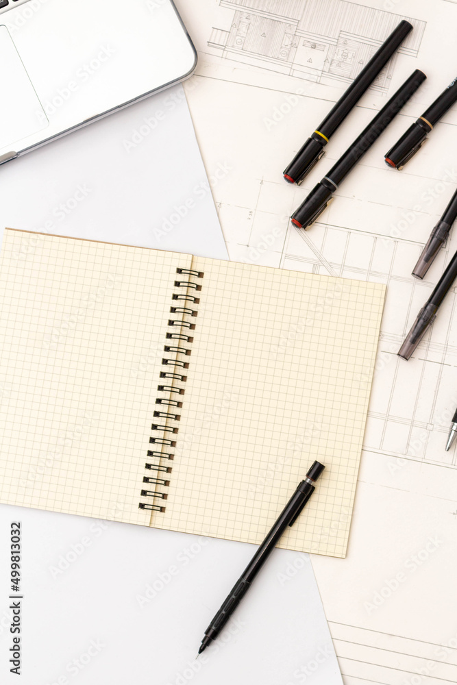 Mockup of architectural concept, Drawing tool on white background and engineer drawing on blueprint Mockup of architectural concept, Drawing tool on white background and engineer drawing on blueprint