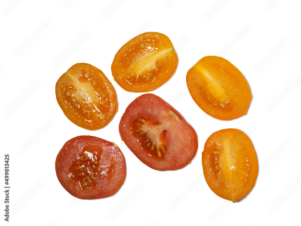 Sliced juicy tomatoes of different varieties on a white background. Orange tomatoes in the greenhouse. Healthy food. Vegetarian food. Still life of vegetables Sliced juicy tomatoes of different varieties on a white background. Orange tomatoes in the greenhouse. Healthy food. Vegetarian food. Still life of vegetables