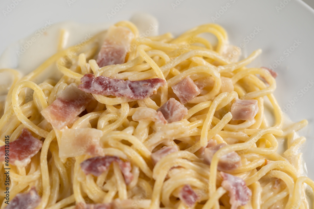 carbonara spaghetti with cream on white plate carbonara spaghetti with cream on white plate