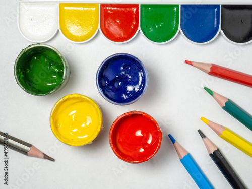 Wallpaper Mural Jars with yellow, green, red paint and pencils  on a white background. Banks of gouache. Bright background.  Creative Torontodigital.ca