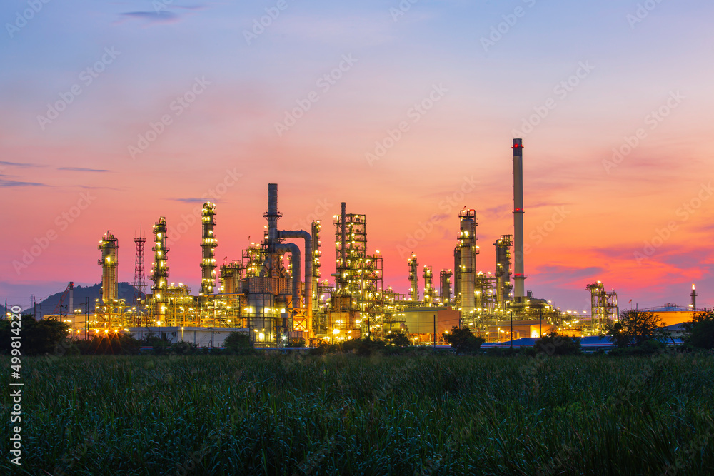 Fototapeta premium Oil​ refinery​ and​ plant and tower column of Petrochemistry industry in oil​ and​ gas​ ​industrial with​ cloud​ red sky