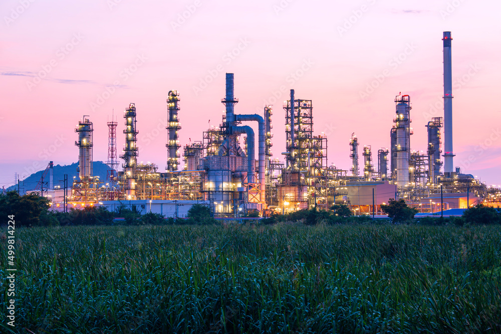 Oil​ refinery​ and​  plant and tower column of Petrochemistry industry in oil​ and​ gas​ ​industry with​ cloud​ red ​sky the morning