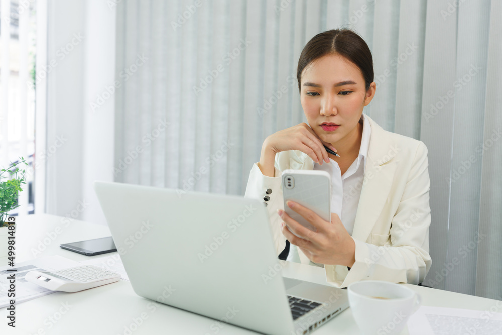 Confidence woman concept, Businesswoman use smartphone to checking data for analyzing strategy Confidence woman concept, Businesswoman use smartphone to checking data for analyzing strategy