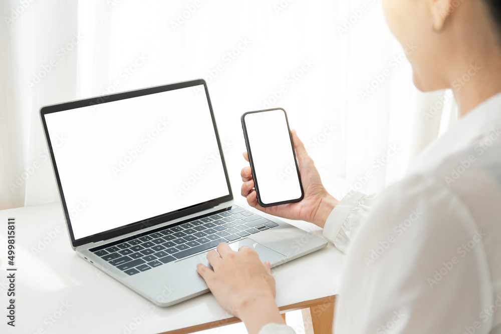computer screen,cell phone blank mockup.hand woman work using laptop texting mobile.white background for advertising,contact business search information on desk in cafe.marketing,design computer screen,cell phone blank mockup.hand woman work using laptop texting mobile.white background for advertising,contact business search information on desk in cafe.marketing,design