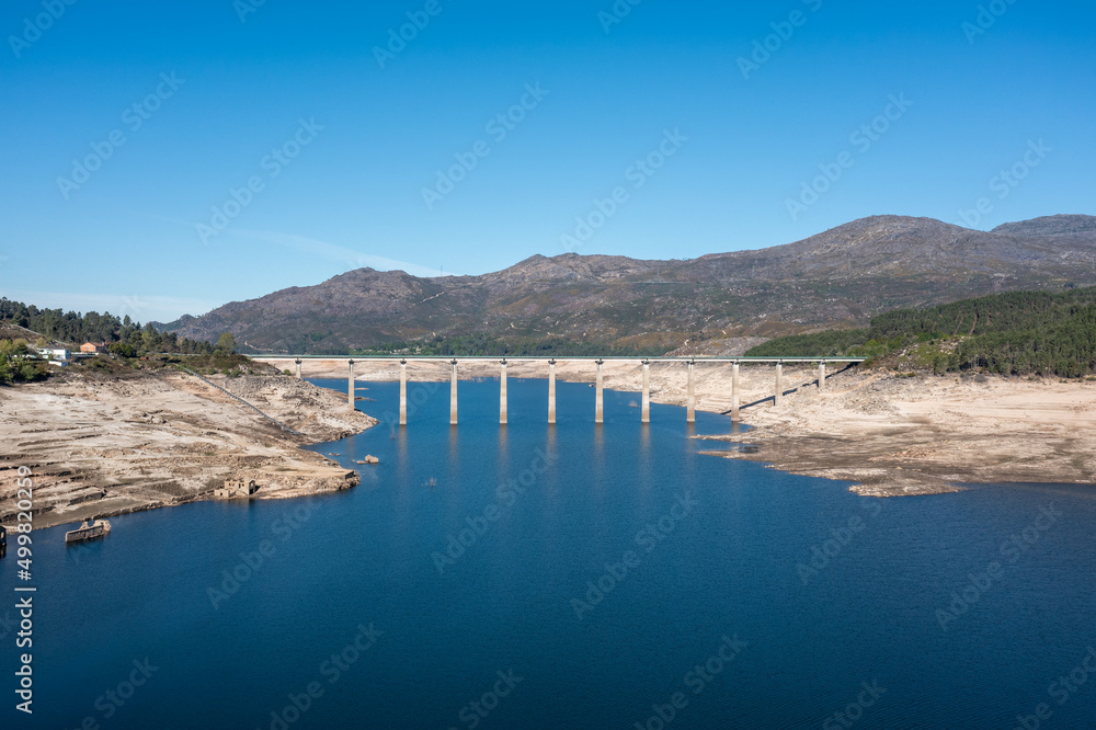view of the bridge crossing the almost emtpy Alto Lindoso Reservoir