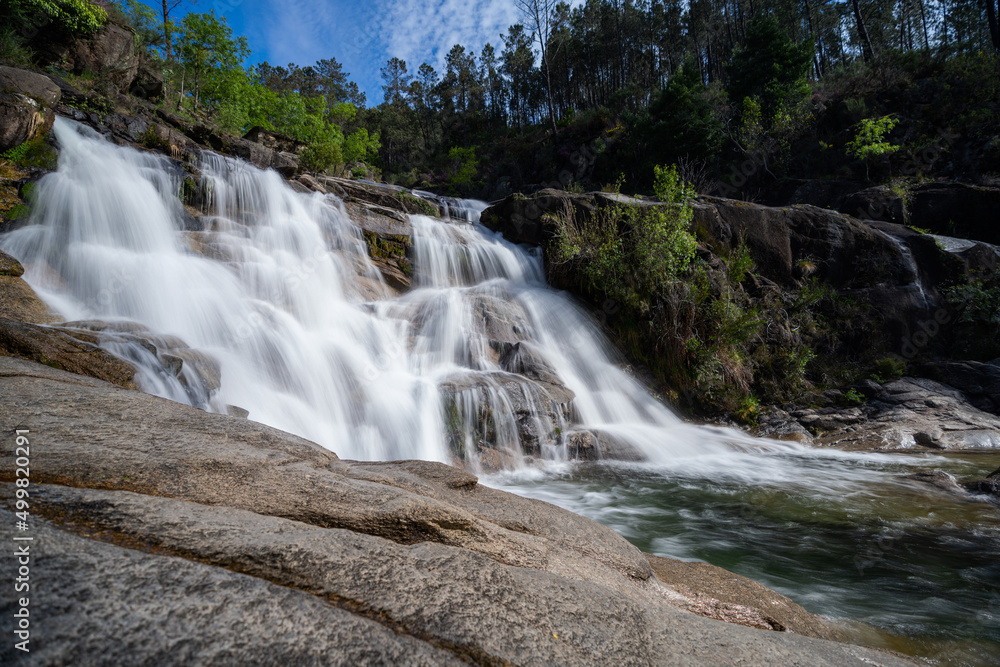 view of the Cascata Fecha de Barjas waterfalls in the Peneda-Geres National Park in Portugal view of the Cascata Fecha de Barjas waterfalls in the Peneda-Geres National Park in Portugal