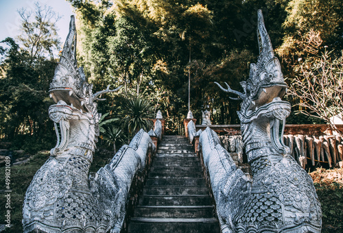 Wat Pha Lat or Wat Palad, old temple in jungle, Chiang Mai, Thailand photo