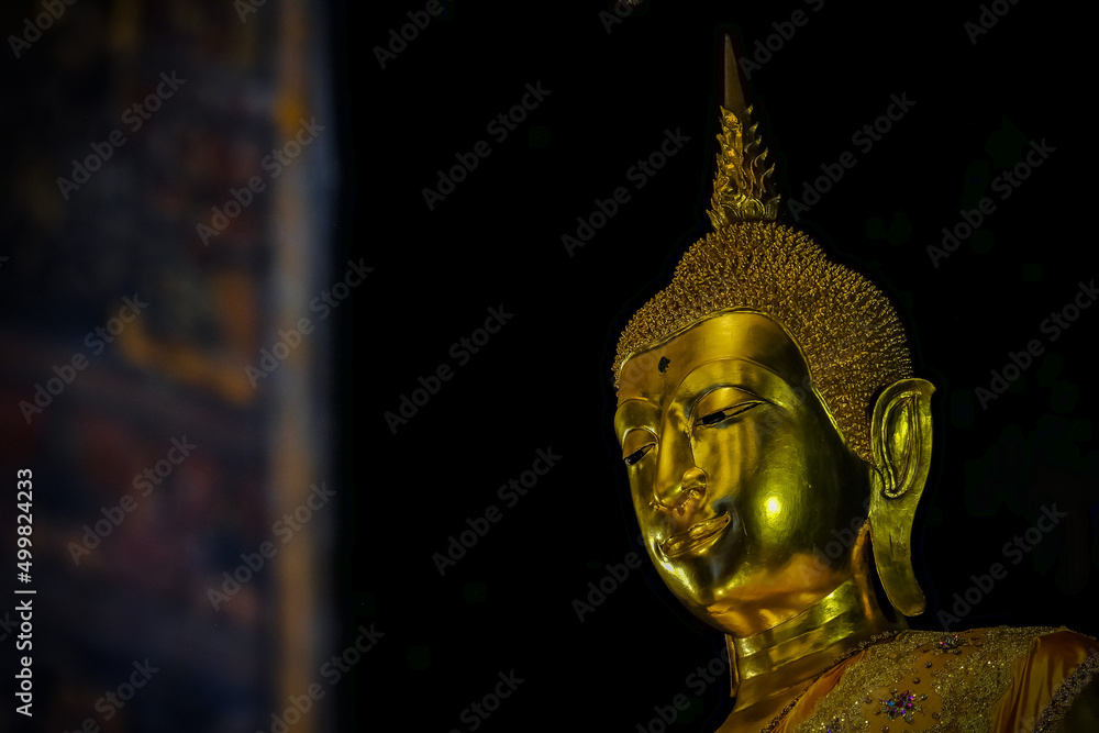 Fototapeta premium Wat Prayoon, a temple in Bangkok with beautiful Buddha images and murals.Photo taken on January 2, 2022 in Bamgkok,Thailand.