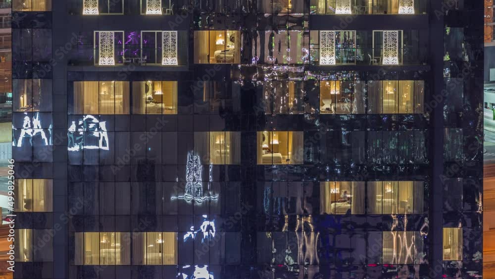 Windows lights in modern towers and residential buildings timelapse at night Windows lights in modern towers and residential buildings timelapse at night