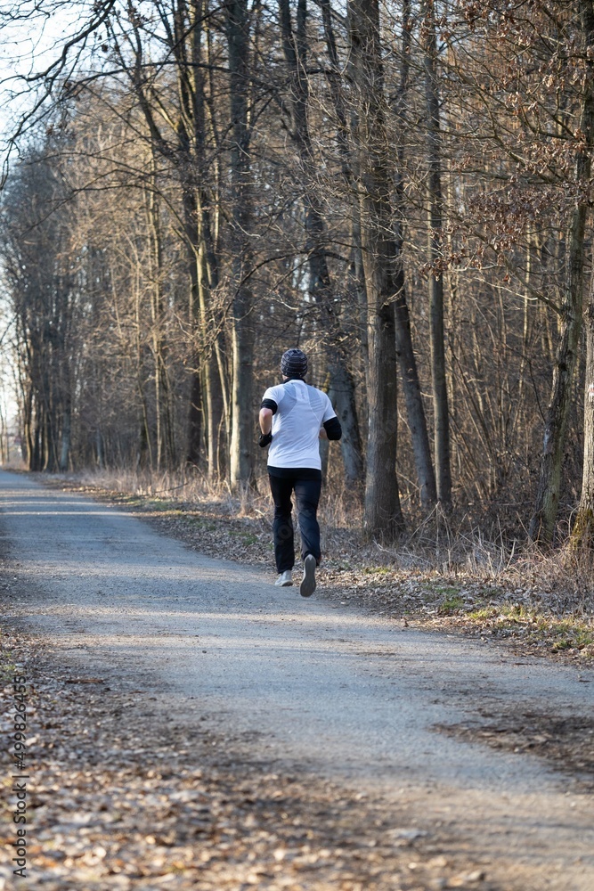 Man running in nature through the natural park Man running in nature through the natural park