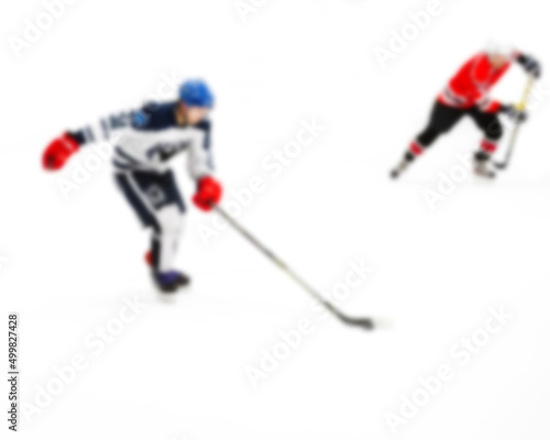 Canvas Print Active movement of hockey players on ice at speed in dynamics - out of focus hoc