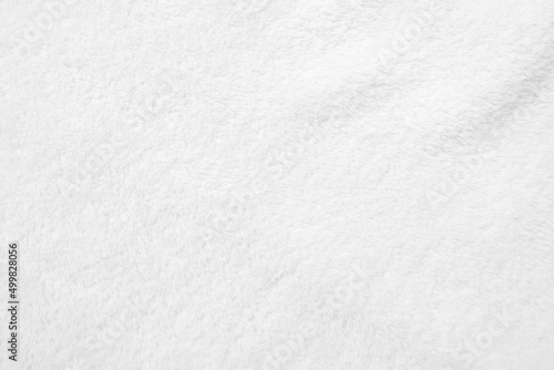 White clean wool texture background. light natural sheep wool. white seamless cotton. texture of fluffy fur for designers. close-up fragment white wool carpet...