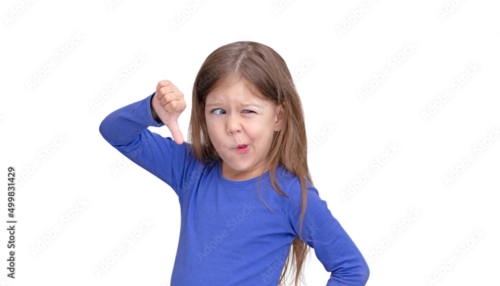 Child holding thumb finger down with funny face Child holding thumb finger down with funny face