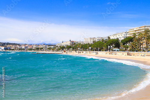 The beach, beach promenade and the town Cannes - France