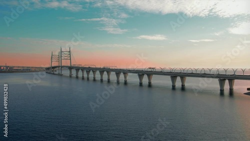 Wallpaper Mural Flying over a bridge over a pond on a quadrocopter at sunset. A road bridge, a major transport highway, an autobahn. Torontodigital.ca