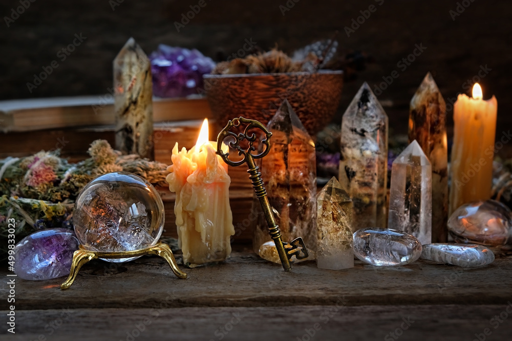 Candles, crystal ball, key, gemstones, magic things on dark wooden background. minerals for Witchcraft, healing Esoteric crystal Ritual. relax, life balance, wiccan, modern magic concept - obrazy, fototapety, plakaty 