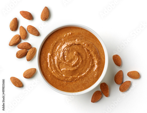 Bowl of almond butter isolated on white background photo