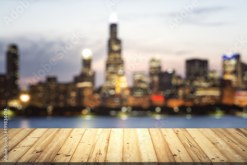 Table top made of wooden dies with blurry city view at dusk on background  template