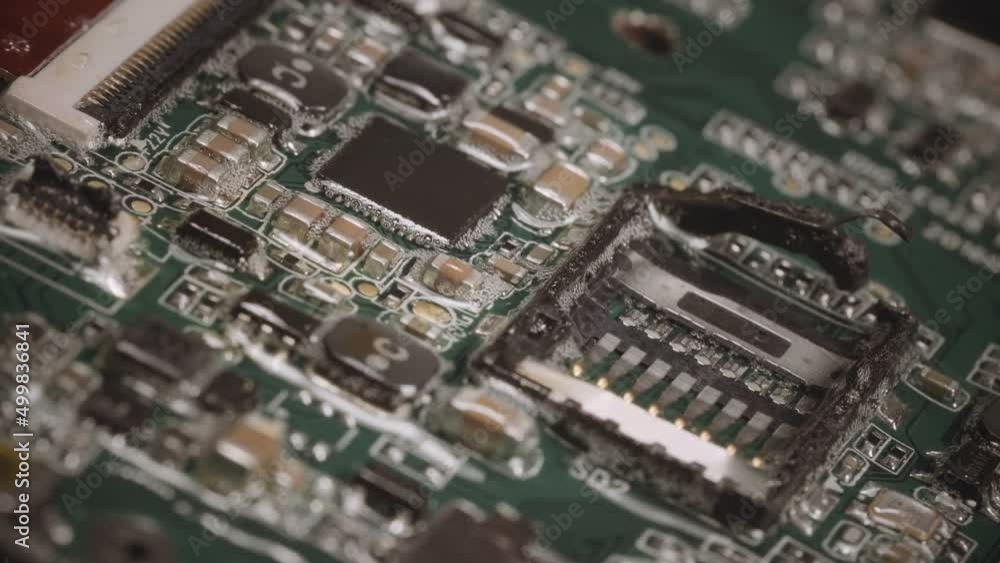 Computer component overheats and begins to melt.
Macro video footage of burning motherboard. Computer component overheats and begins to melt.
Macro video footage of burning motherboard.