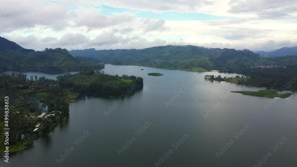 Top view of Lake in the mountains among the tea plantations. Maskeliya, Maussakelle reservior, Sri Lanka. Top view of Lake in the mountains among the tea plantations. Maskeliya, Maussakelle reservior, Sri Lanka.