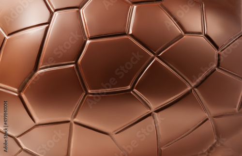 Chocolate Easter egg textured background, close up. Sweet chocolate  Pattern photo