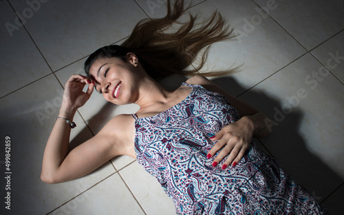 Girl lying with hair heart photo