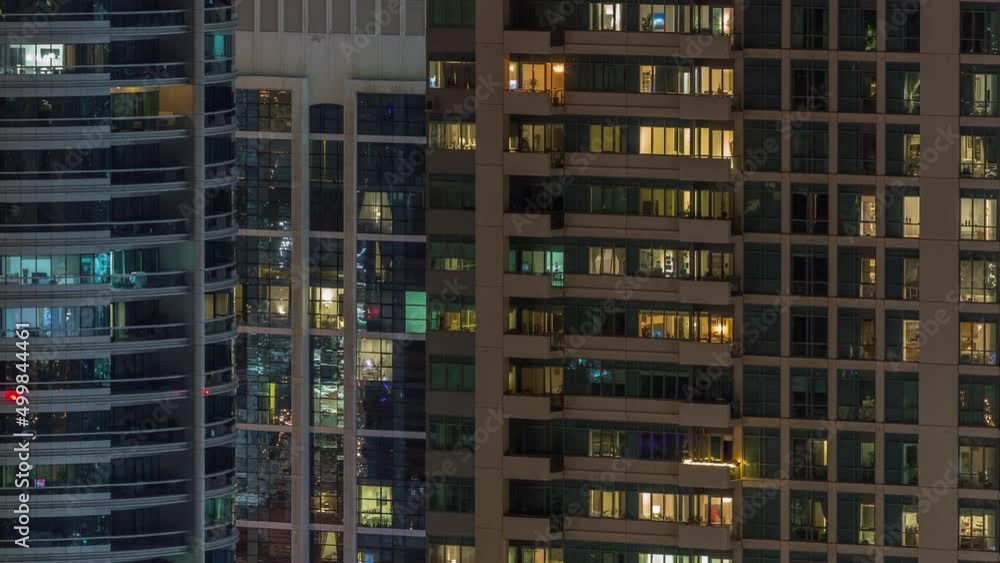 Windows lights in modern office and residential buildings timelapse at night Windows lights in modern office and residential buildings timelapse at night