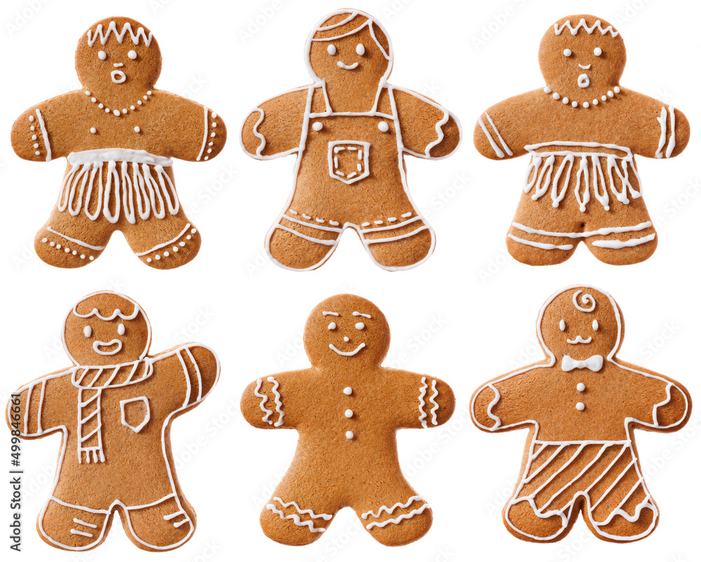 A set of gingerbread men with various decorations made of sugar icing isolated on a white background. A set of gingerbread men with various decorations made of sugar icing isolated on a white background.
