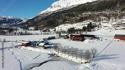 Winter exterior view of Smalahovetunet Lono farm at Voss - Famous for sheeps head special culinary and farm christmas parties - Norway sunny day aerial photo