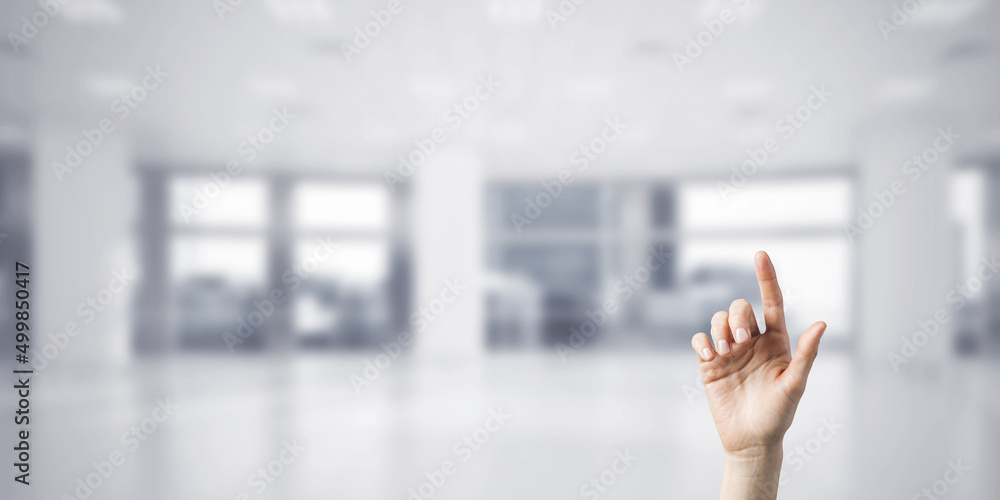 Choosing gesture of person in elegant modern interior in sunshine light Choosing gesture of person in elegant modern interior in sunshine light