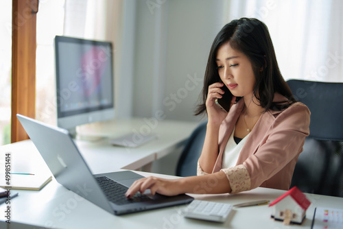 data analysis, plan, marketing, accounting, audit, Portrait of asian business woman holding smart phone of planning marketing using statistical data sheet to present marketing plan project at meeting.