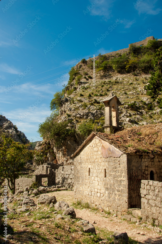 Old fortress wall, church high in mountains in montenegro kotor , ancient landmark historical