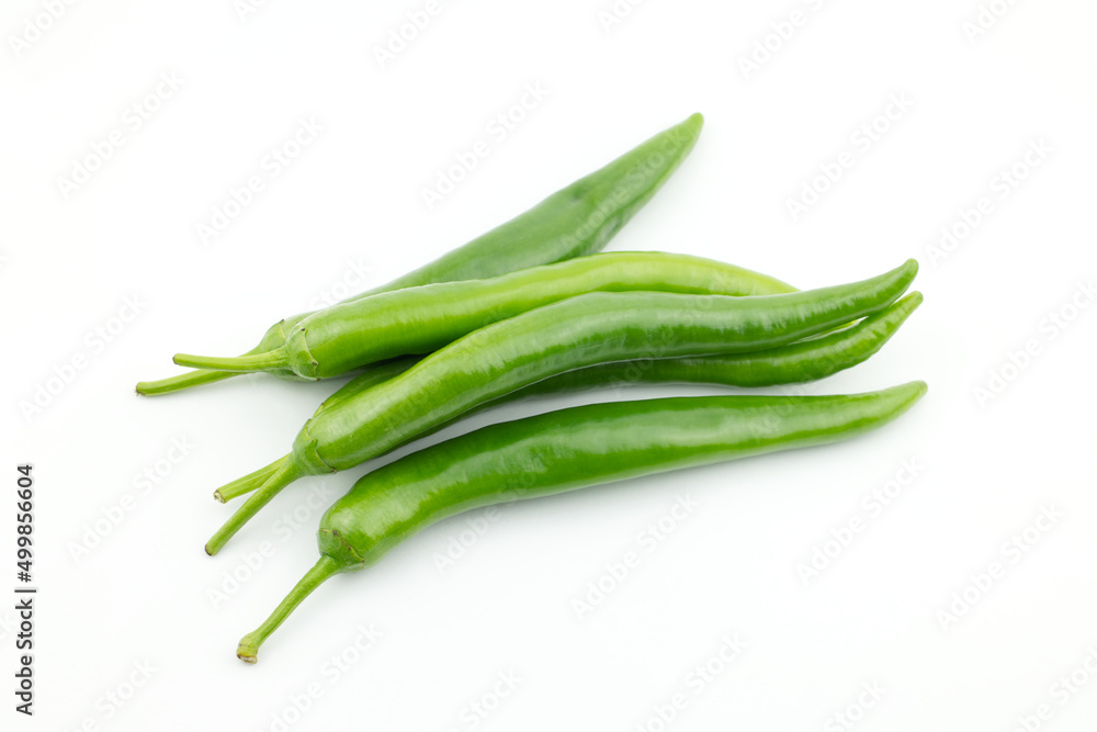 Pile of fresh raw ripe hot organic green chili peppers whole isolated on white background clipping path, top view Pile of fresh raw ripe hot organic green chili peppers whole isolated on white background clipping path, top view