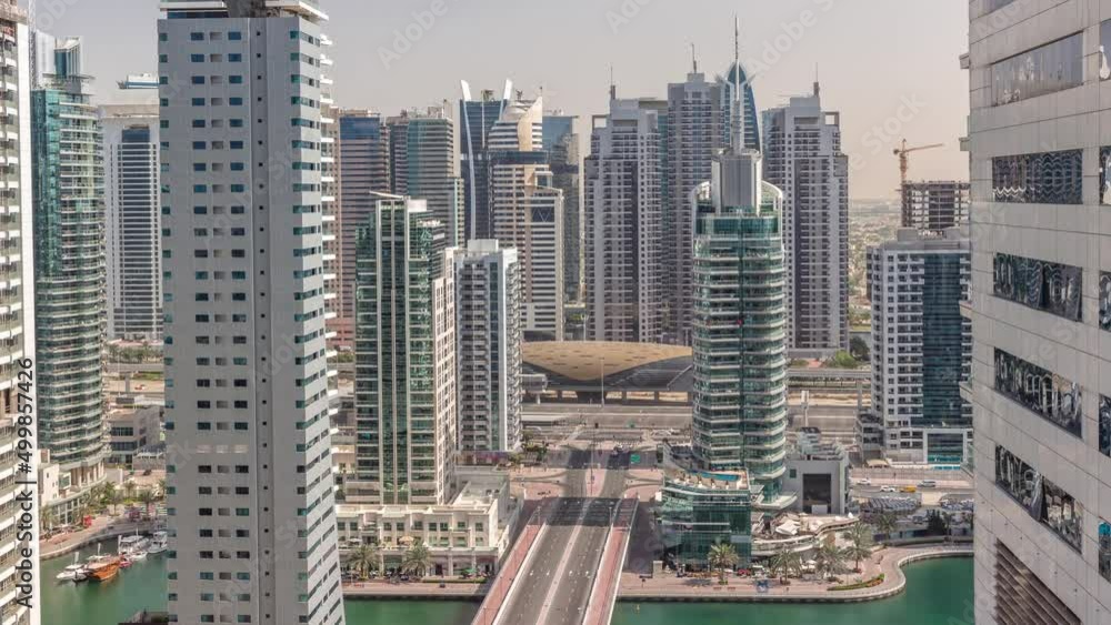 Aerial view on Dubai Marina skyscrapers and the most luxury yacht in harbor timelapse, Dubai, United Arab Emirates Aerial view on Dubai Marina skyscrapers and the most luxury yacht in harbor timelapse, Dubai, United Arab Emirates