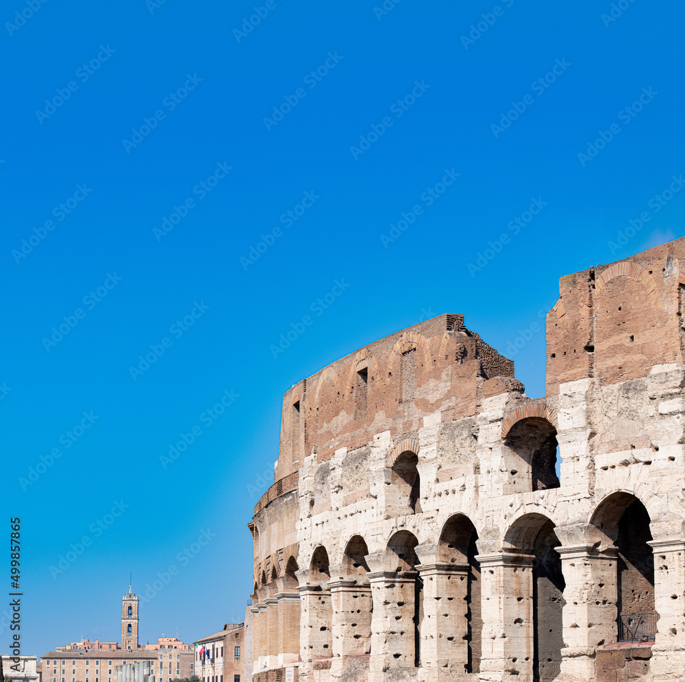 Colosseum external view no people, copy space on blue sky on top, Rome Italy tourism