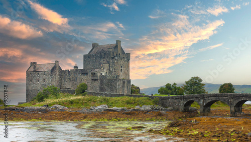 Scenic view of medieval castle in Scotland Eilean Donan sunset sky