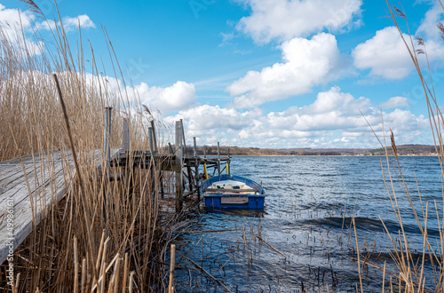 kleines Ruderboot im Schilfrohr am Selliner See photo