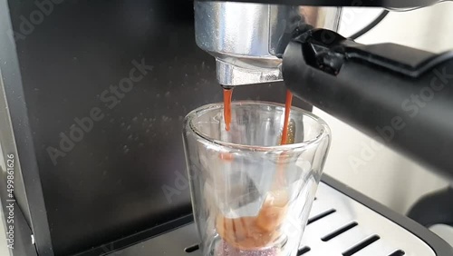 Coffee espresso stream from machine in cup