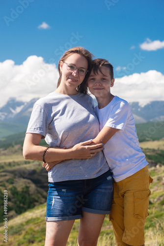 A child embraces mom in the...