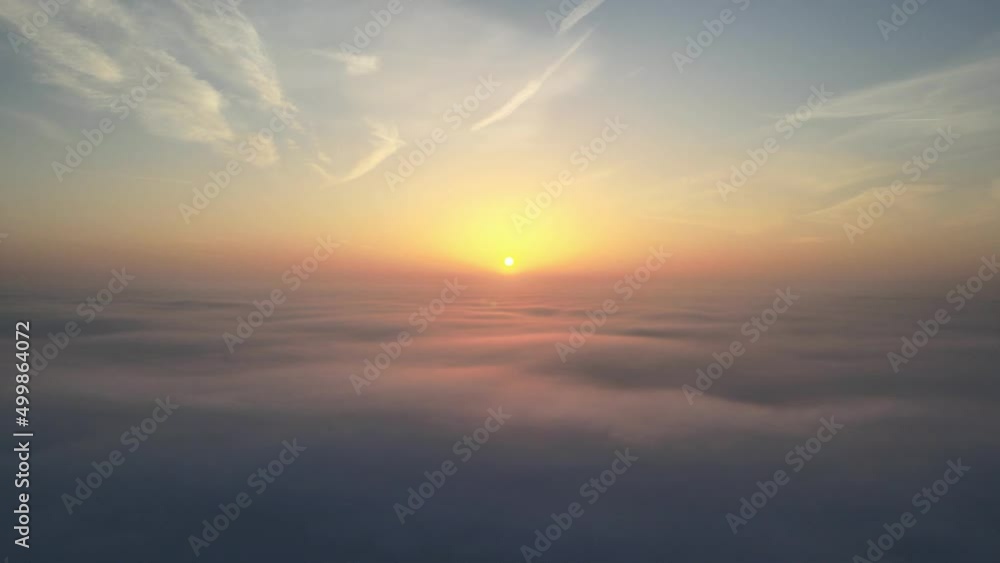 Aerial drone shot of moody sunrise above the clouds Aerial drone shot of moody sunrise above the clouds