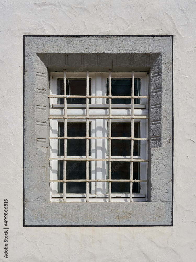 Fototapeta premium single window with window grille in the old town of Wittenberg in Germany