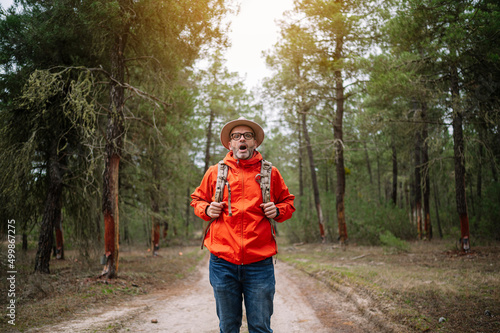 Картината върху платно Portrait of a man with a hat in a forest.