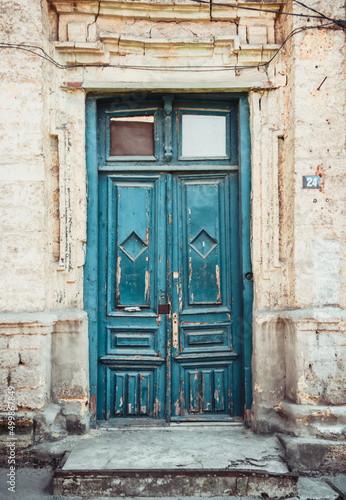 Old rickety wooden blue door