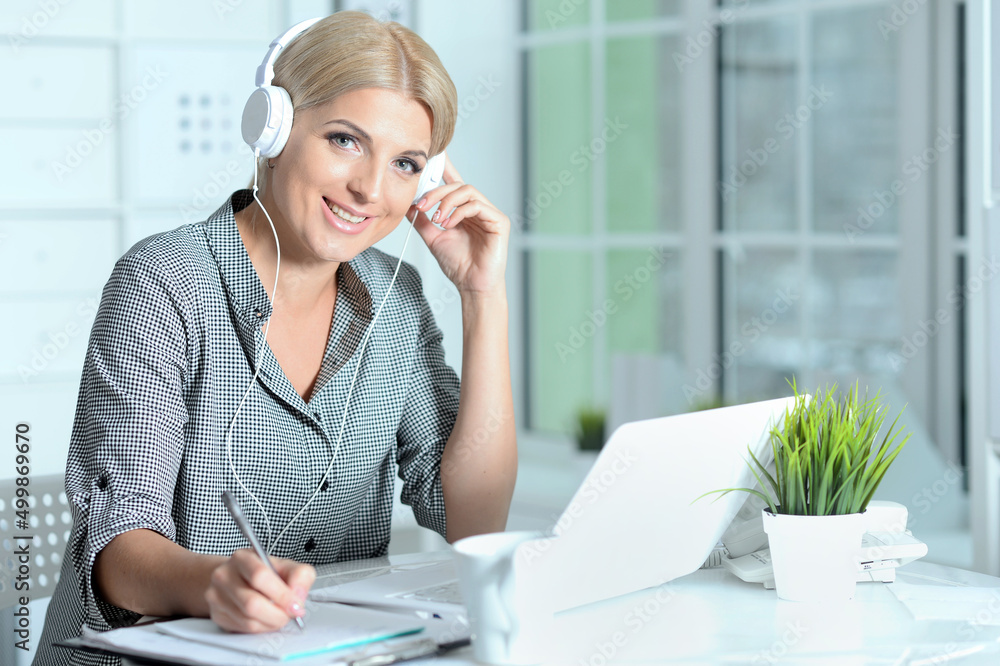 Portrait of young woman working with laptop at office Portrait of young woman working with laptop at office