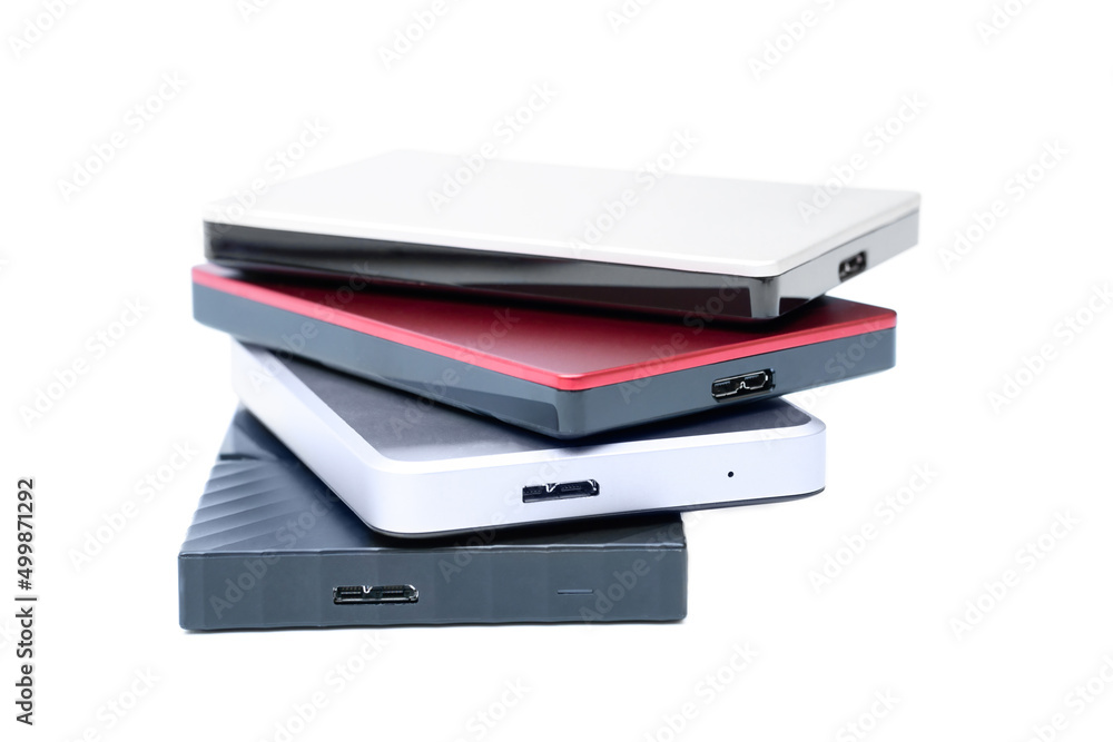Four portable external hard disk drives stacked Four portable external hard disk drives stacked