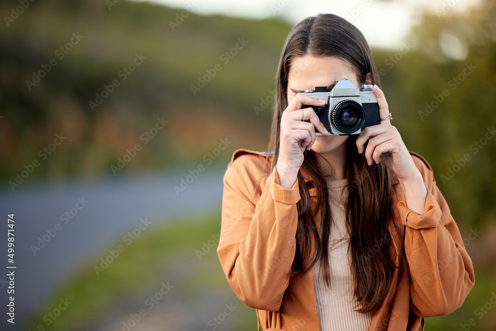 Ill be traveling many miles and taking many many pictures. Shot of a young woman using her camera while spending time outdoors. Ill be traveling many miles and taking many many pictures. Shot of a young woman using her camera while spending time outdoors.
