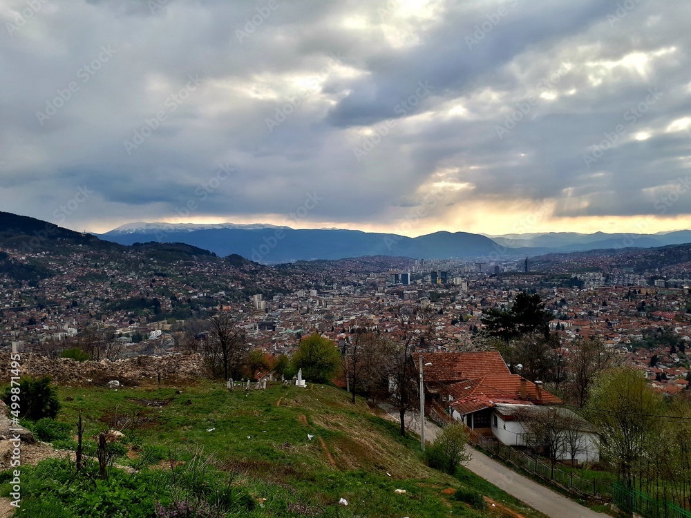 Fototapeta premium Panorama of Sarajevo, mountain Trebevic, Igman, Bjelasnica and Bitovnja seen from Zmajevac viewpoint, Bosnia and Herzegovina