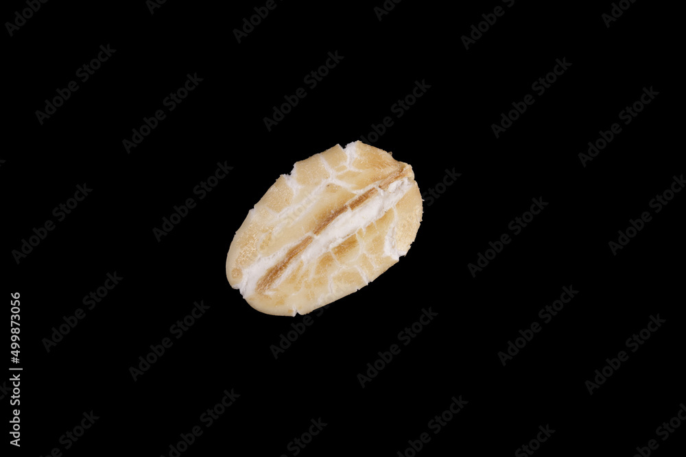 natural oat seed isolated on black background