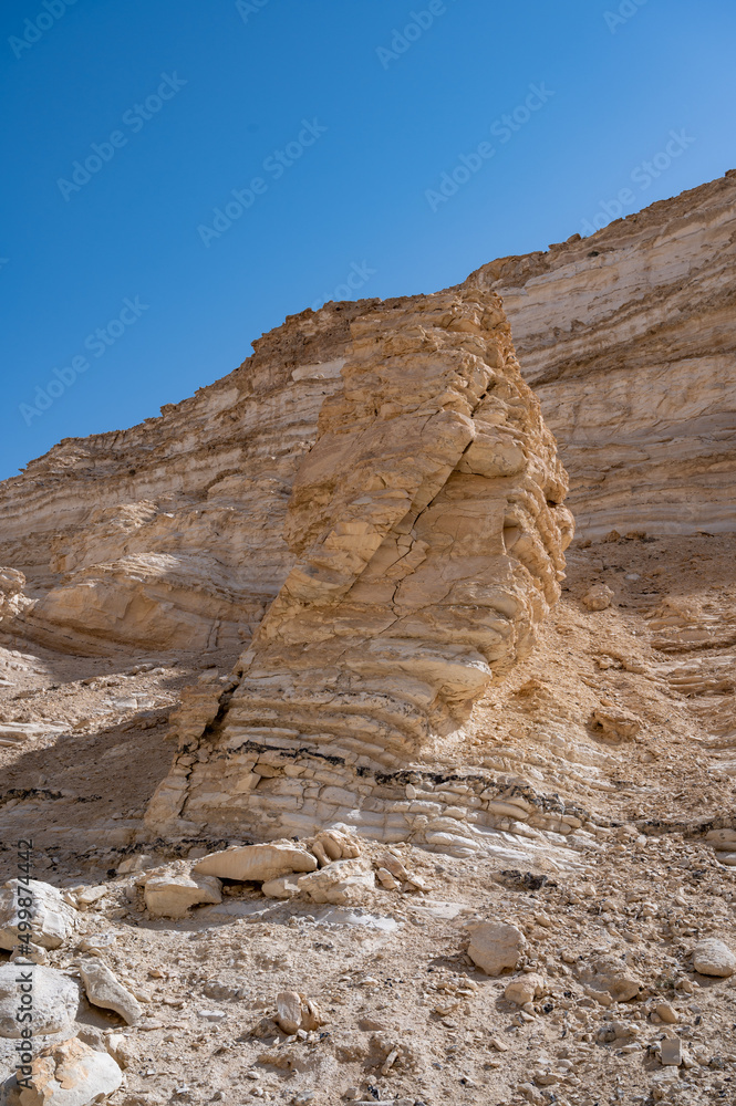Fototapeta premium Trail head of the Canyon of Ein Avdat National Park, oasis in the Negev Desert, Southern Israel, Text is: Ein Avdat, Ein Mor