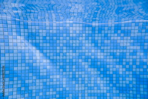 Mosaic of the underwater pool. Photo of underwater swimming pool background.